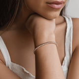 Model wearing Luce Sottile Tennis Bracelet — refined gold vermeil shine