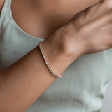 Gold tennis bracelet styling — Luce Sottile Bracelet worn with minimal outfit